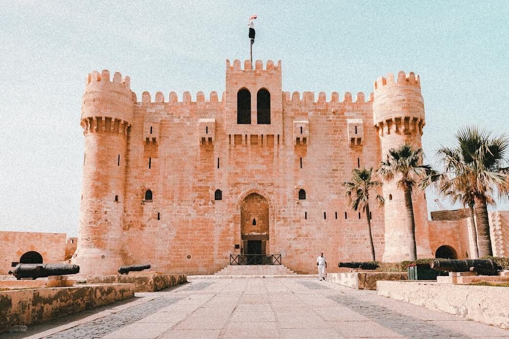 fortification with towers and palm trees